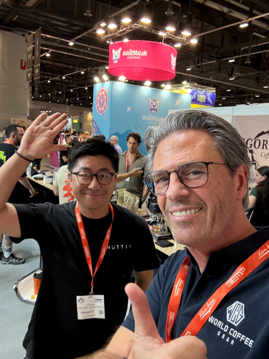 Jochem Snels meeting a coffee industry partner at World of Coffee in Geneva