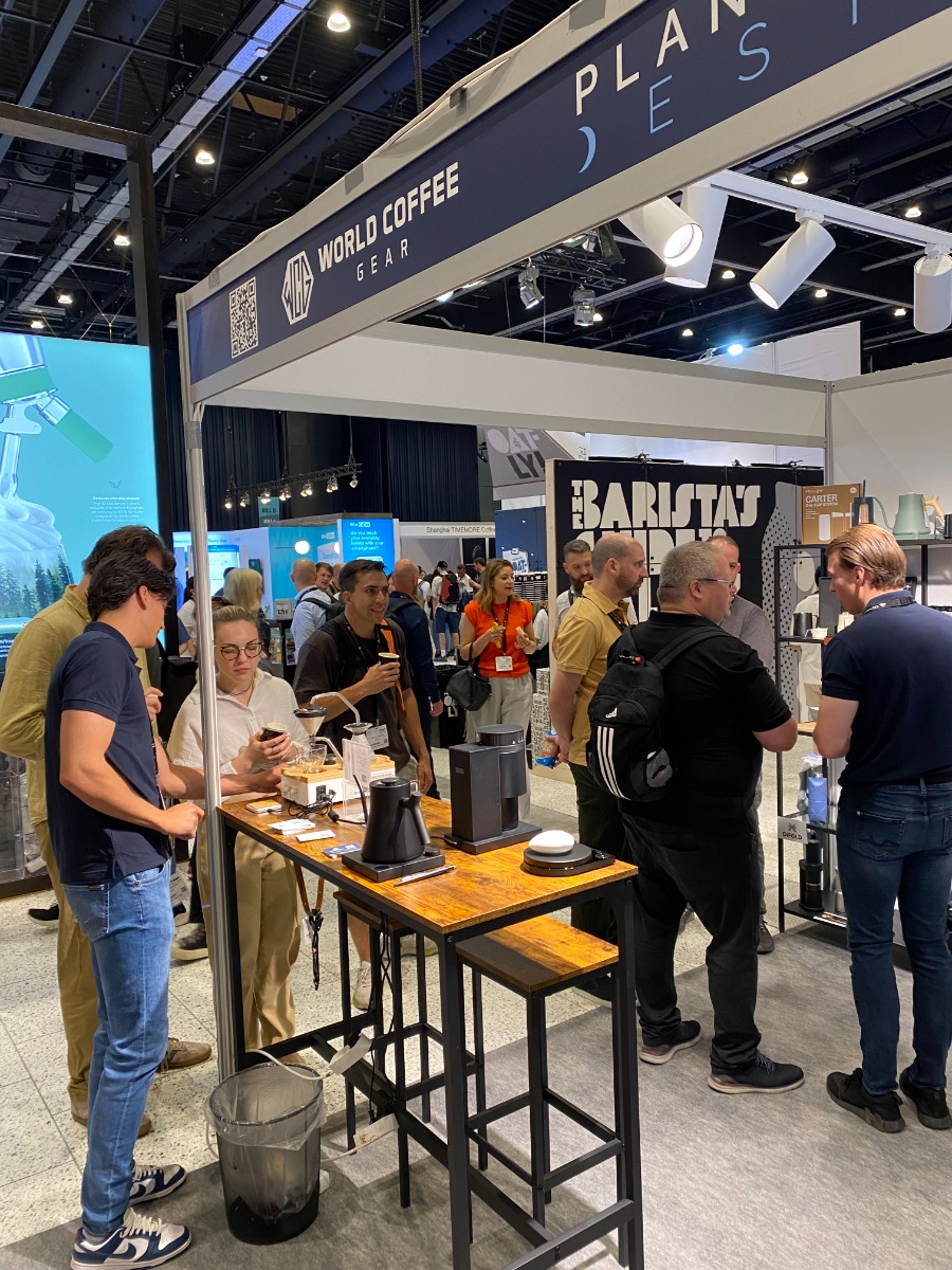 Visitors discovering coffee gear at the World Coffee Gear stand during World of Coffee Copenhagen